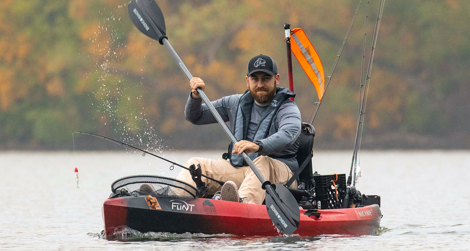 Man In Paddle Fishing Kayak