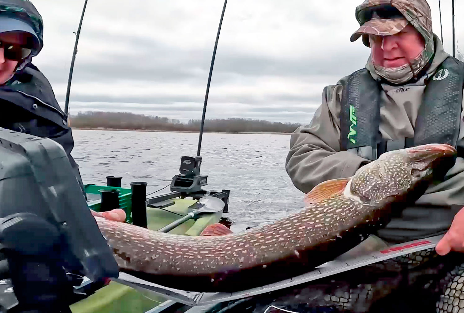 Elite Kayak Angler Ron Strauss Measuring A Pike