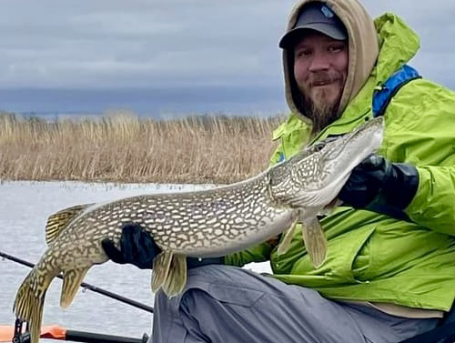 Billy DeBoer Holding A Big Pike