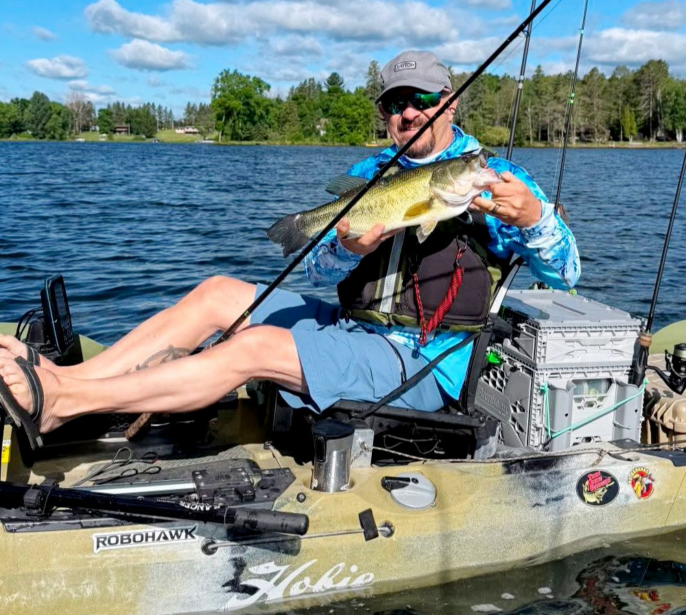 Mark-In-Hobie-Outback | Minnesota Kayak Fishing Association Mark In Hobie Outback Holding A Bass