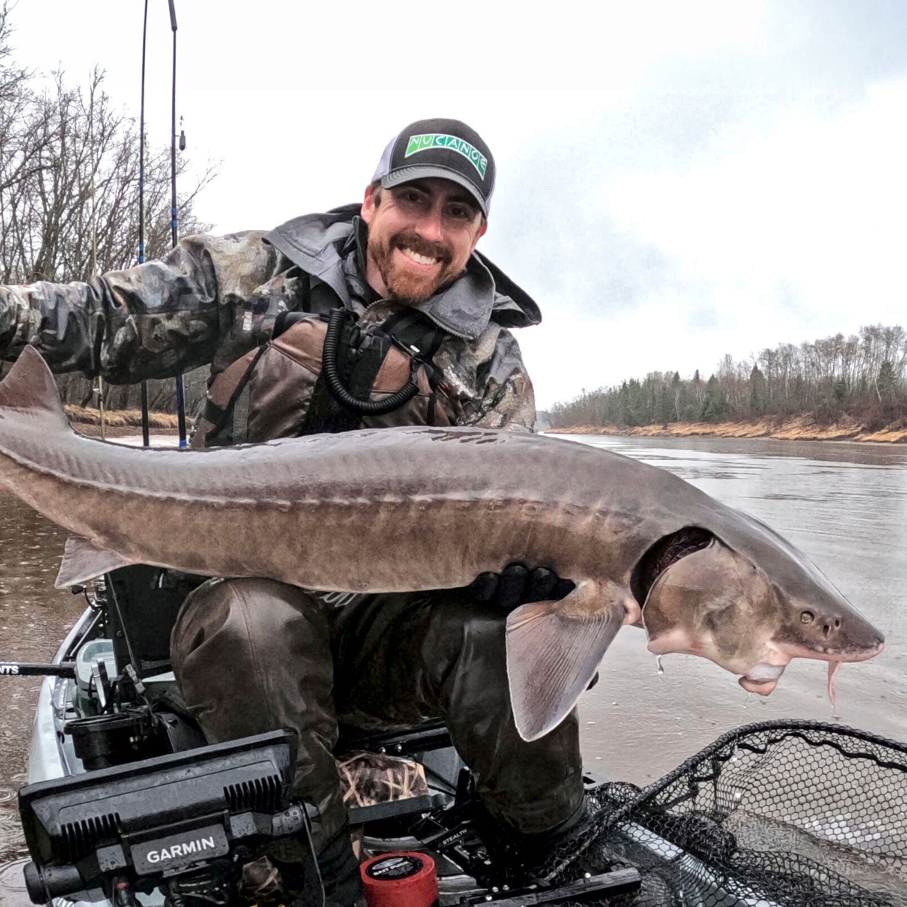 Eric-Scrivner-Holding-A-Sturgeon | Minnesota Kayak Fishing Association Eric Scrivner Holding A Sturgeon