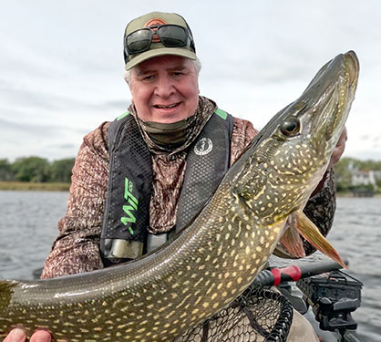 Ron Strauss Holding A Northern Pike