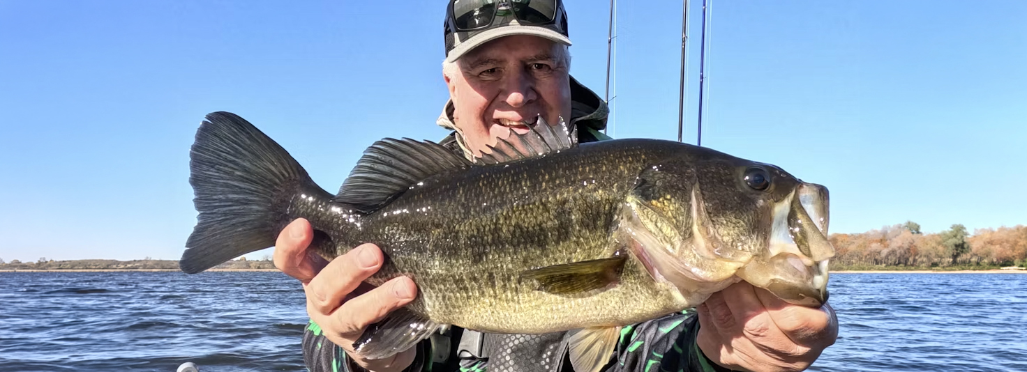 Ron Strauss Holding A Steiger Lake Bass